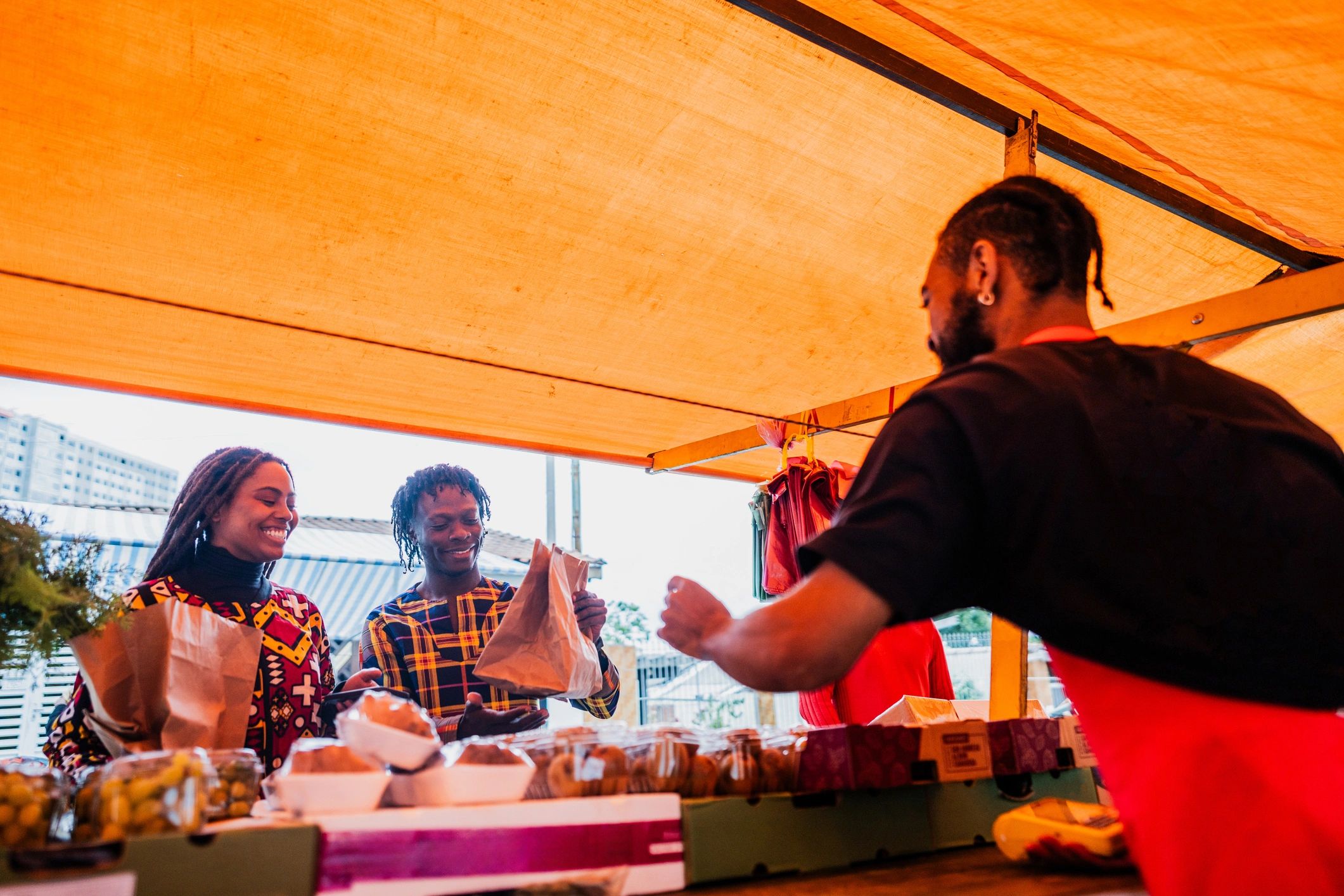 Customers shopping at an outdoor street market
