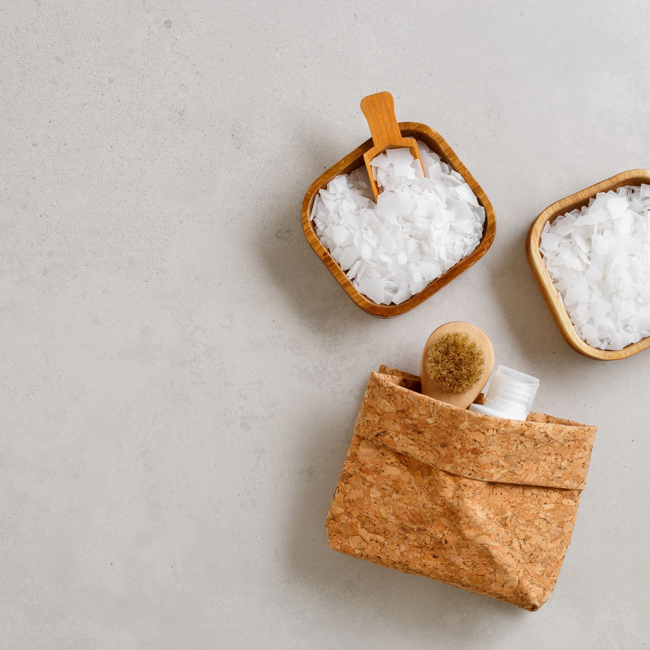 Sea salt flat lay with bowls and neutral spa accessories