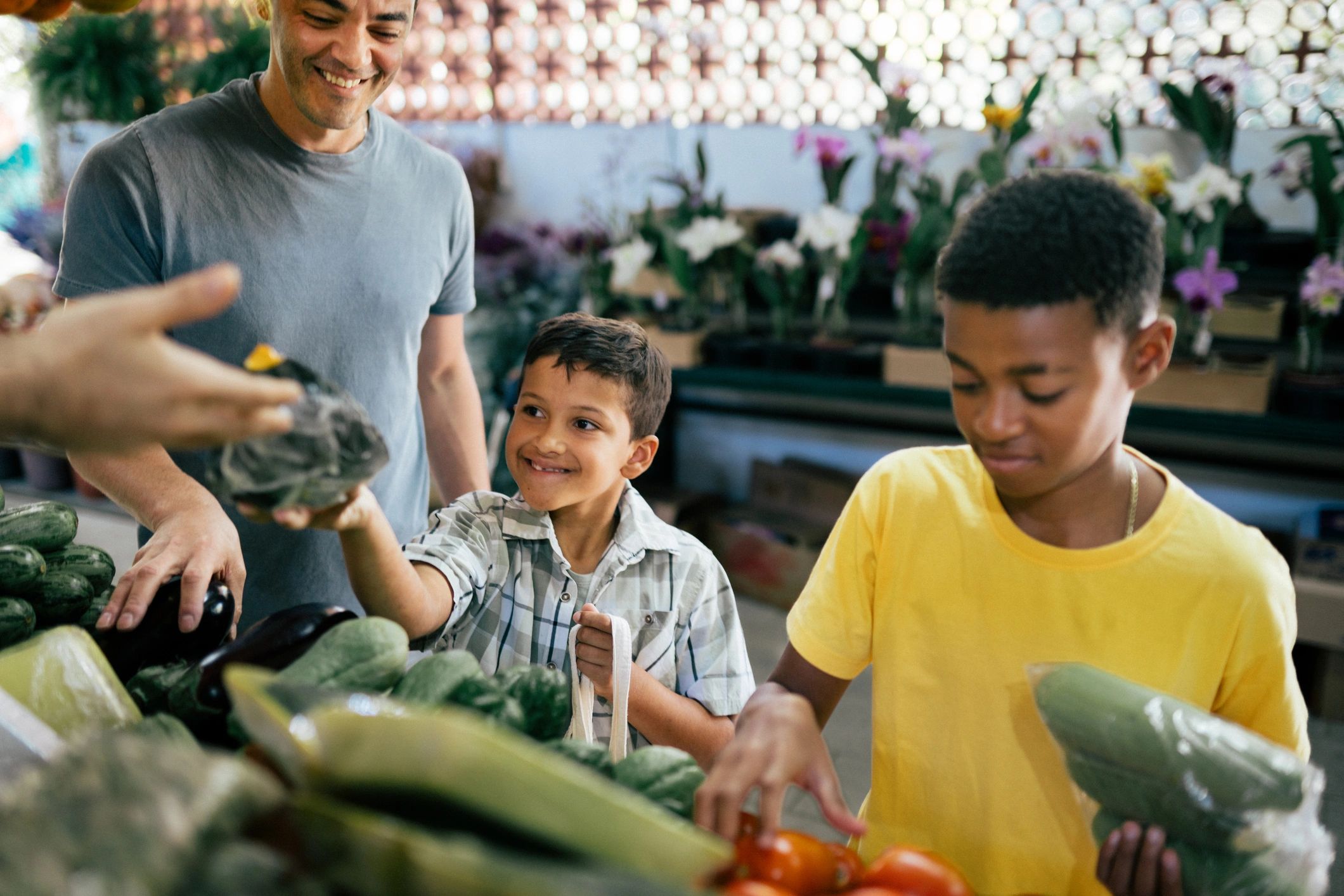 Shoppers selecting produce at a local farmers market